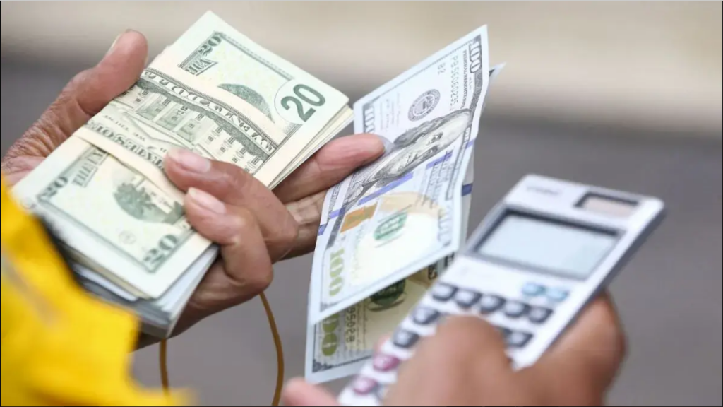 Dolares y una calculadora