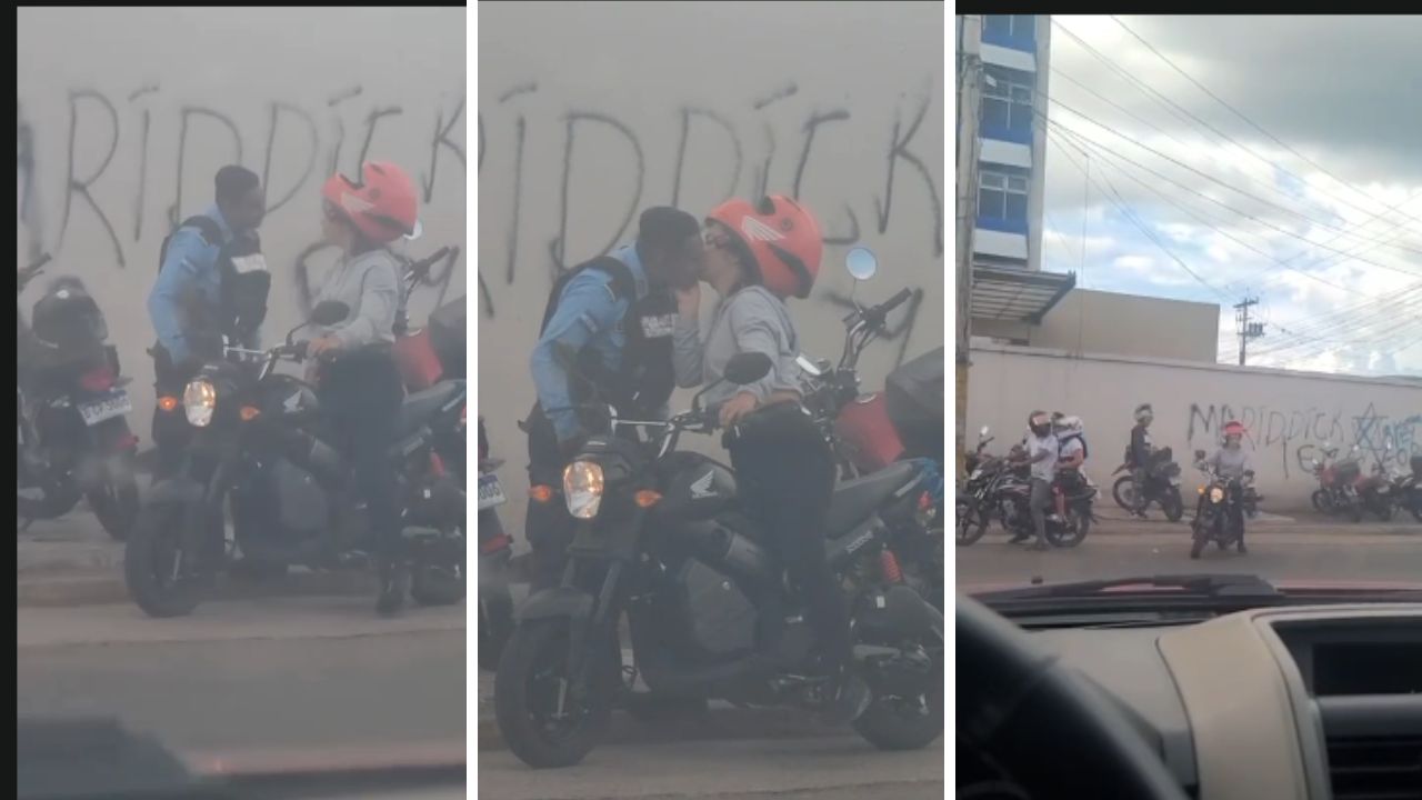 'Todo sea por la esquela': policía recibe beso de motociclista en Tegucigalpa