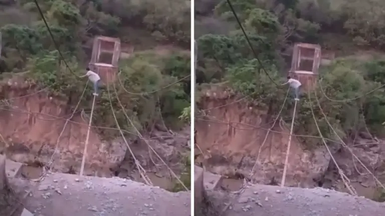 Imagen Principal de Nota: Captan a hombre cruzando un río sobre cables de puente en Lempira