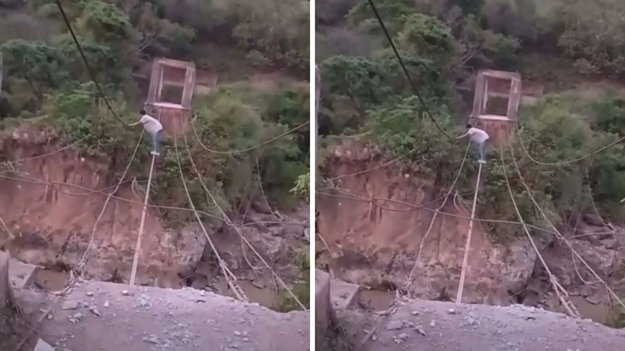 Captan a hombre cruzando un río sobre cables de puente en Lempira